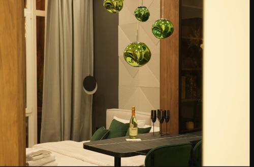 a dining room with a table and green balls at Luxury apartment with jacuzzi Pechersk Plaza in Kyiv
