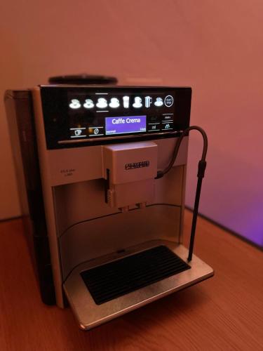 a sewing machine sitting on top of a stand at Relax studio Cheb in Cheb