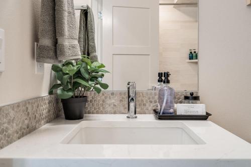a white sink in a bathroom with a mirror at Wallingford View Suite BY Betterstay in Seattle