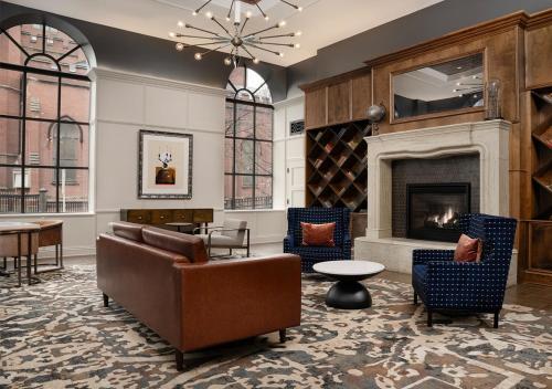 a living room with furniture and a fireplace at Hotel Indigo Baltimore Downtown, an IHG Hotel in Baltimore