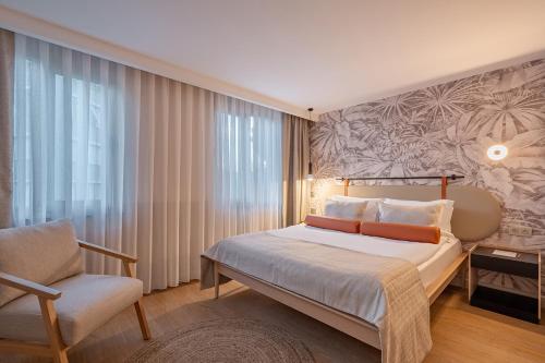 Postel nebo postele na pokoji v ubytování Oli Hotel and Suites