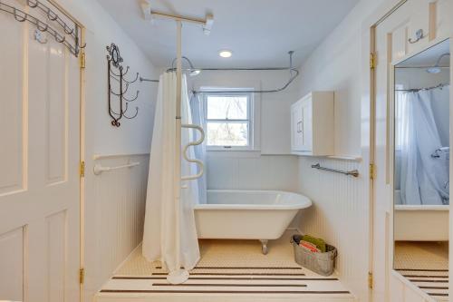 a bathroom with a bath tub and a window at Westcliffe Home with Deck Less Than Half-Mi to Main Street! in Westcliffe