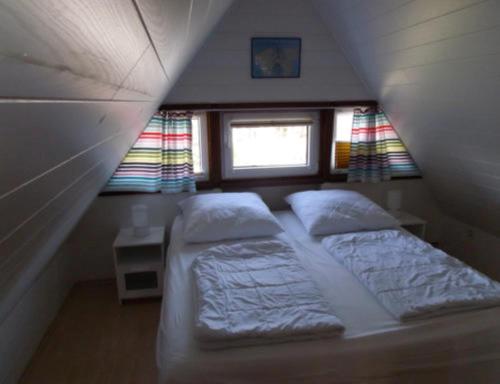 Кровать или кровати в номере Ferienhaus Niemann