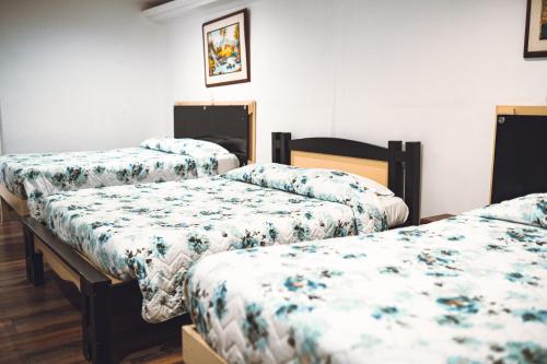 En eller flere senge i et værelse på Hotel Raíces Casona Real