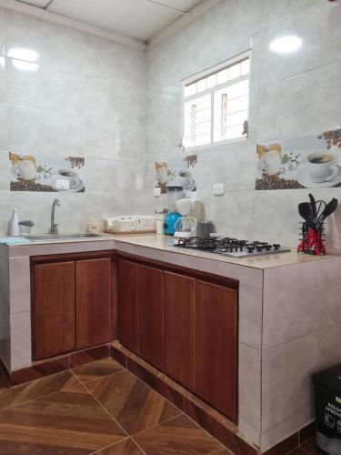 Køkken eller tekøkken på Cabaña Amadeus cerca al mar