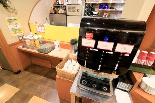 a coffee machine sitting on a counter in a store at Richmond Hotel Utsunomiya-ekimae in Utsunomiya