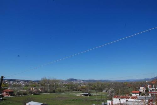 a view of a city with a blue sky at Nikos Apartments in Ioannina