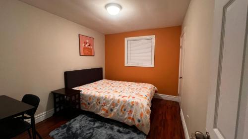 a small bedroom with a bed and a window at Affordable Downtown Private Rooms in Windsor