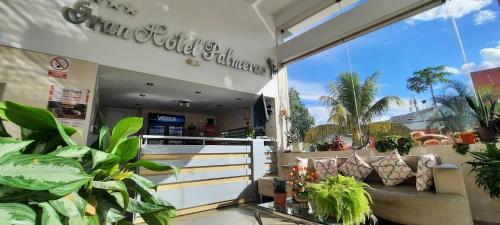 a store with plants in the front of it at Gran Hotel Palmeras in Jaén