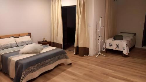 Postel nebo postele na pokoji v ubytování Recanto dos Sonhos