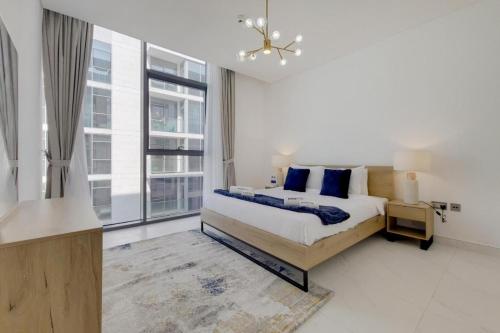 a bedroom with a bed and a large window at MBR CITY One Brdoom Apatment in Dubai