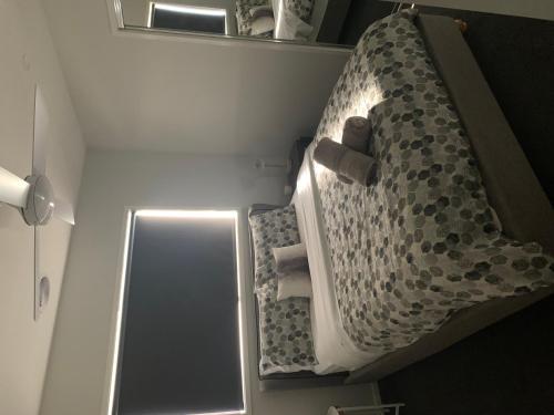 a bunk bed in a room with a mirror at Dan's Rise in Mansfield