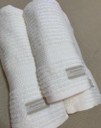 two white towels sitting next to each other at Pousada Le Sorelle ap04 in Rosário do Sul