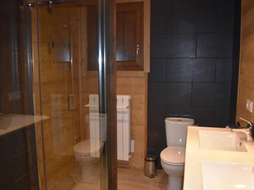 a bathroom with a toilet and a glass shower at Chalet Font-Romeu-Odeillo-Via, 6 pièces, 12 personnes - FR-1-580-103 in Font-Romeu-Odeillo-Via