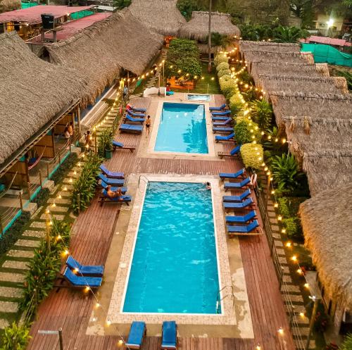 an overhead view of a pool at a resort at Tiki Hut Hostel in Palomino