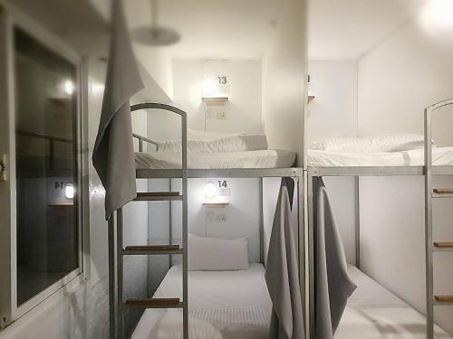 a room with three bunk beds in it at COZY Home in Taipei