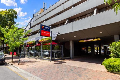 a building with a basketball hoop in front of it at Econo Lodge North Adelaide in Adelaide