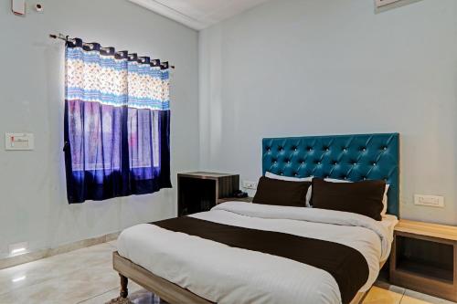 Postel nebo postele na pokoji v ubytování Collection O Maharaja Resort