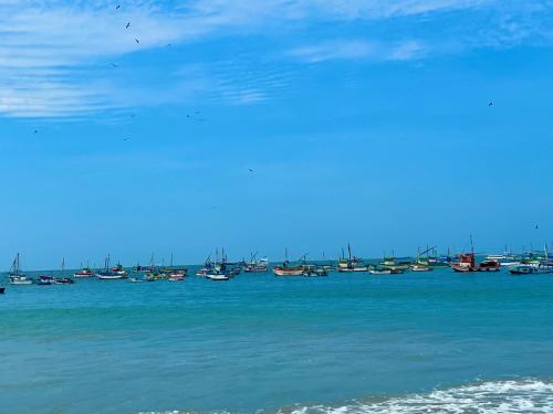 a group of boats sitting in the water at PUNTA VELEROS ROOFTOP in Los Órganos