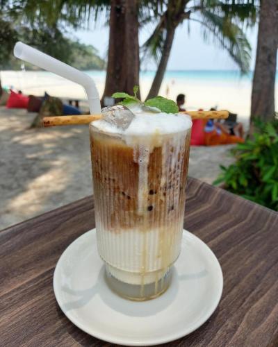 a drink sitting on a plate on a table at Koh Kood Club in Ko Kood