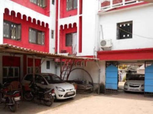 a car parked in a garage next to a building at HOTEL STEP IN Bhubaneswar in Bhubaneshwar