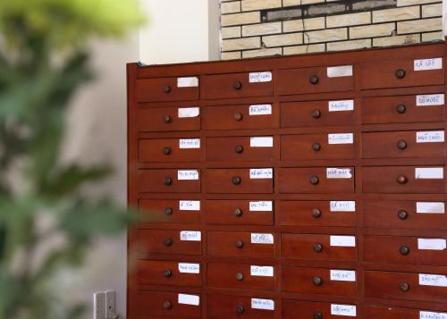 a chest of drawers with labels on them at Vit-troi Room - Family 5 person - Duck Homestay Ben Tre in Ấp Phú Lợi