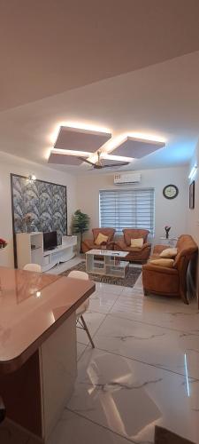 a large living room with couches and a couch at 1 bhk luxury flat in Trivandrum