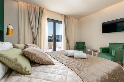 Postel nebo postele na pokoji v ubytování Hotel Vila Hedonija