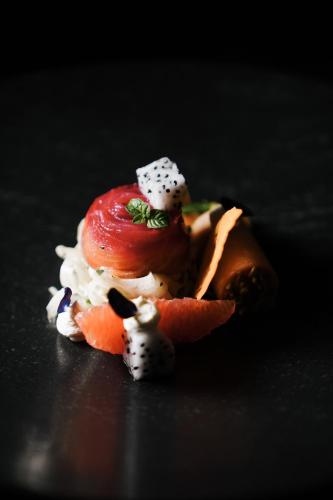a piece of food on a table with sushi at Hotel Sun Valley in Selva di Val Gardena