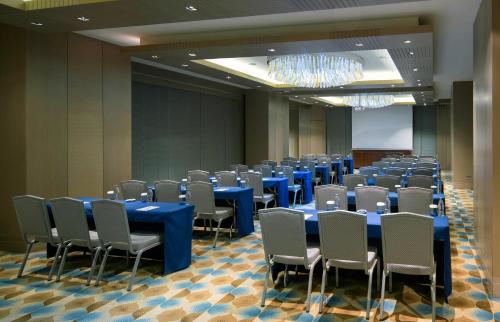 a conference room with blue tables and chairs at Windsor Hotel & Convention Center Istanbul in Istanbul