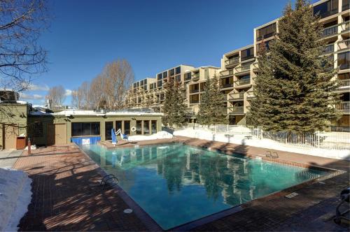 a large swimming pool in front of a building at The Keystone Lodge and Spa by Keystone Resort in Keystone