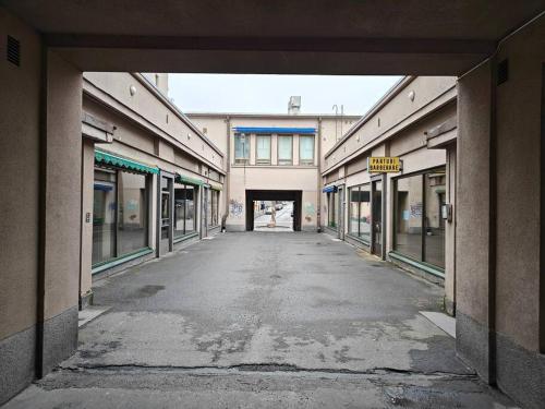 an empty alley way in a building with windows at Brooms - Newly renovated central studio apartment in Pietarsaari