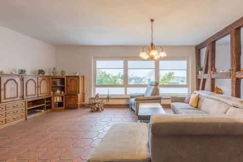 a living room with a couch and a table at Ferienwohnung Erika in Dassow