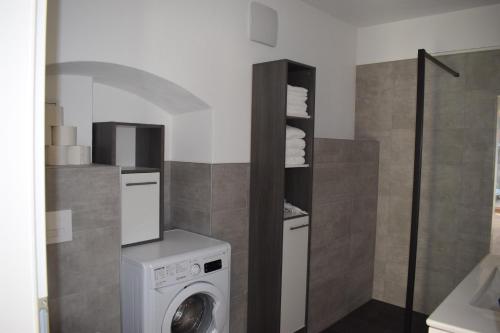 a bathroom with a washing machine in a bathroom at Stein Reich in Oberwölz Stadt