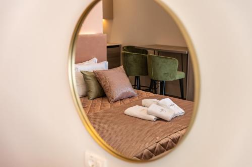 Postel nebo postele na pokoji v ubytování Hotel Vila Hedonija