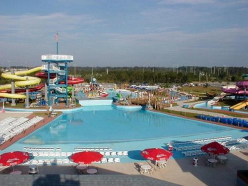 a large swimming pool in a water park at Holiday Inn Express - Gulfport Beach by IHG in Gulfport