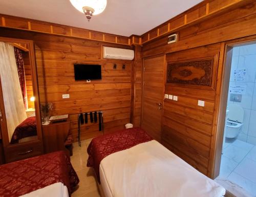 Ένα ή περισσότερα κρεβάτια σε δωμάτιο στο Marmara Guesthouse