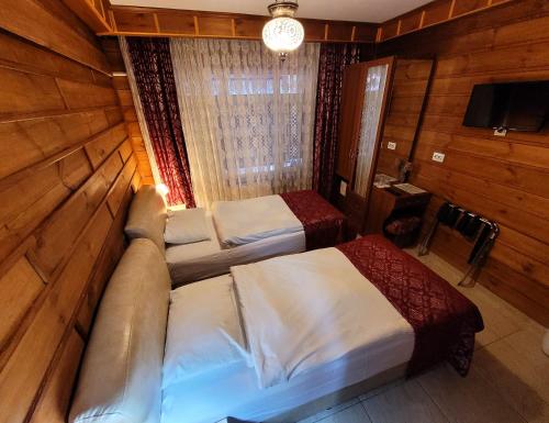 Ένα ή περισσότερα κρεβάτια σε δωμάτιο στο Marmara Guesthouse