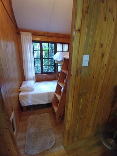 a small room with a bed and a bunk bed at Crocodile Nest B&B in Nelspruit