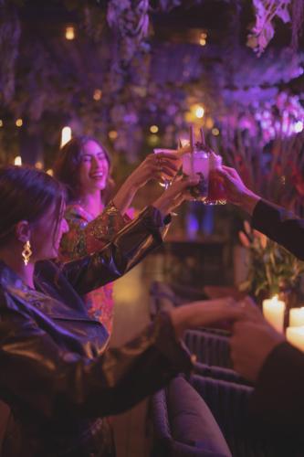 a group of people raising their glasses at a party at The View Agadir in Agadir