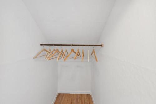 a row of wooden hangers hanging on a wall at Marianne in Büsum