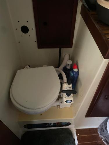 a bathroom with a toilet in a small room at Séjour unique à bord d un voilier in La Rochelle