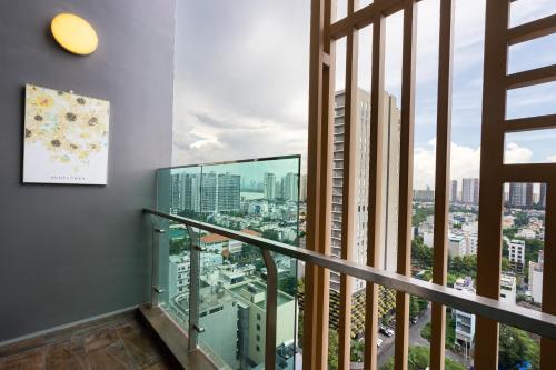 a balcony with a view of a city at DingD0ng Home FelizEnVista 5-star facilities in Ho Chi Minh City