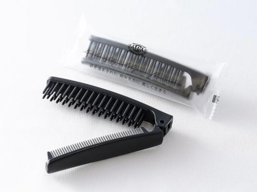 a black comb and a white toothbrush at APA Hotel TKP Tokyo Nishi-Kasai in Tokyo