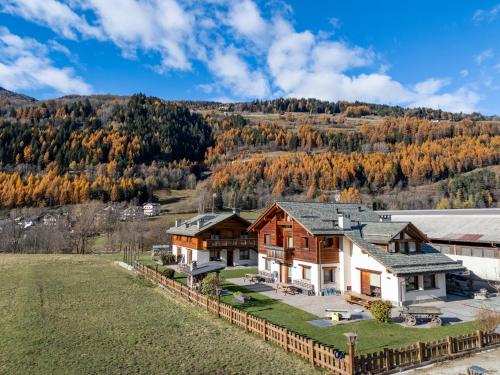 an aerial view of a house with a hill in the background at Agriturismo La Stalla in Bormio