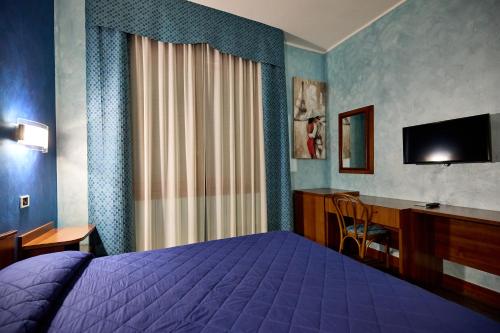 Postel nebo postele na pokoji v ubytování HOTEL PARADISO