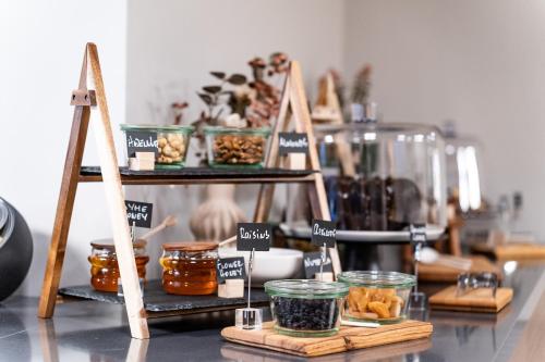 a shelf filled with jars of food on a table at 507 Athens in Athens
