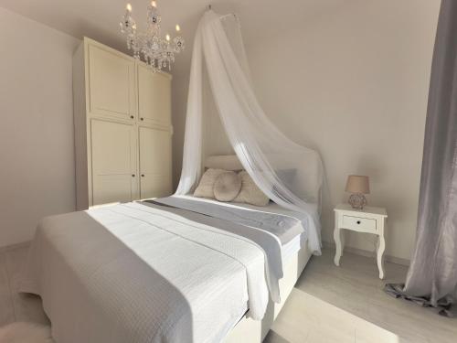 Posteľ alebo postele v izbe v ubytovaní Elite Residence Flos