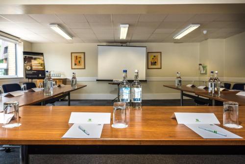 a conference room with tables and bottles of water on them at Holiday Inn Lancaster by IHG in Lancaster