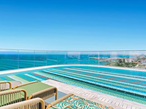 a view of a swimming pool from a building at NYX Hotel Limassol by Leonardo Hotels in Limassol